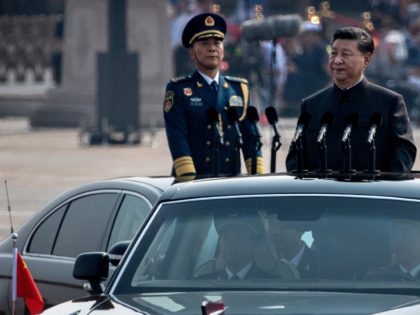 BEIJING, CHINA - OCTOBER 01: Chinese President Xi Jinping drives in a Hong Qi car after inspecting the troops during a parade to celebrate the 70th Anniversary of the founding of the People's Republic of China at Tiananmen Square in 1949, on October 1, 2019 in Beijing, China. (Photo by …