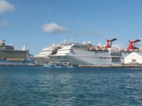 Royal Caribbean ship Allure of the Seas (L) and Carnival Cruise ships Liberty and Elation are seen in Nassau, Bahamas on April 29, 2019. (Photo by Daniel SLIM / AFP) (Photo credit should read DANIEL SLIM/AFP/Getty Images)