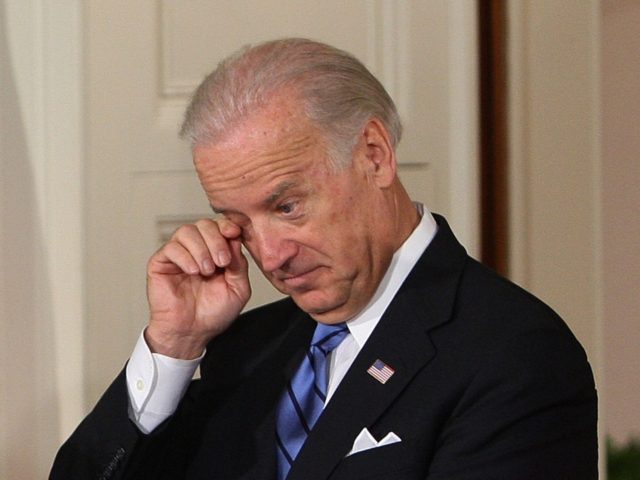 Vice President Joe Biden wipes his eye as he and Secretary of State Hillary Rodham Clinton