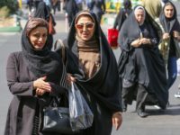 Iranian women walk in Sadeqyeh Square in the capital Tehran on October 8, 2019. - After a ban spanning decades, Iranian women are set to freely enter a football stadium for the first time on October 10 as Iran hosts Cambodia in a World Cup 2022 qualifier at Tehran's Azadi …