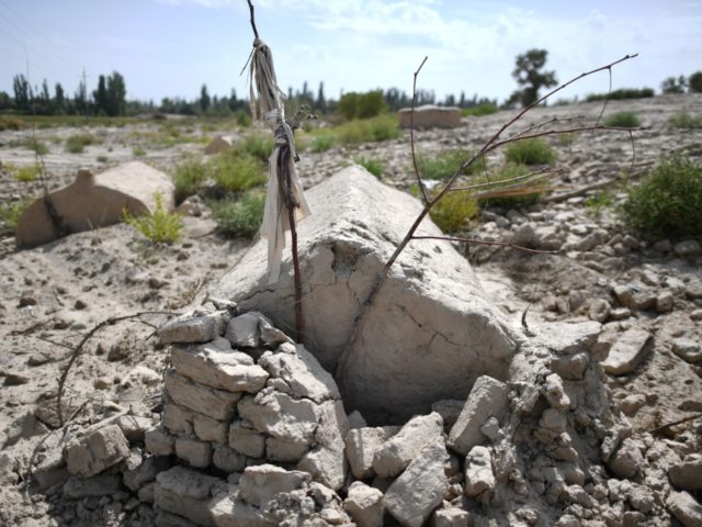 This photo taken on September 12, 2019 shows what used to be a traditional Uighur cemetery before it was destroyed in Shayar in the region of Xinjiang. - China is destroying burial grounds where generations of Uighur families have been laid to rest, leaving behind human bones and broken tombs …