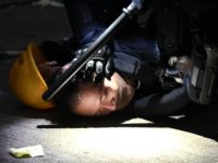 TOPSHOT - A man is detained by police during clashes in the Wanchai district in Hong Kong on October 1, 2019, as the city observes the National Day holiday to mark the 70th anniversary of communist China's founding. - Strife-torn Hong Kong on October 1 marked the 70th anniversary of …