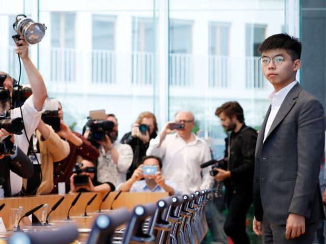 Prominent Hong Kong activist Joshua Wong faces photographers before holding a press conference, on September 11, 2019 in Berlin. - Joshua Wong had met Germany's Foreign minister the day before as he carried abroad his call to support the growing pro-democracy movement in the former British colony, a meeting slammed …