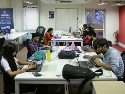 Employees work on their computers at the office of HackerEarth in Bangalore, India, Wednes