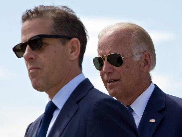 Family members gather for a road naming ceremony with U.S. Vice President Joe Biden, centr