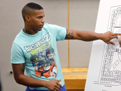 In this Tuesday, Sept. 24, 2019, photo, victim Botham Jean's neighbor Joshua Brown, left, answers questions from Assistant District Attorney LaQuita Long, right, while pointing to a map of the South Side Flats where he lives, while testifying during the murder trial of former Dallas Police Officer Amber Guyger, in …