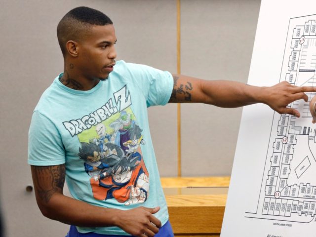 In this Tuesday, Sept. 24, 2019, photo, victim Botham Jean's neighbor Joshua Brown, left, answers questions from Assistant District Attorney LaQuita Long, right, while pointing to a map of the South Side Flats where he lives, while testifying during the murder trial of former Dallas Police Officer Amber Guyger, in …