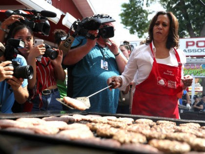DES MOINES, IOWA - AUGUST 10: Democratic presidential candidate U.S. Sen. Kamala Harris (D-CA) cooks pork burgers at the Iowa Pork Producers tent while attending the Iowa State Fair on August 10, 2019 in Des Moines, Iowa. Kamala Harris is on a five day river-to-river bus tour across Iowa promoting …