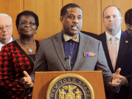 In this Feb. 6, 2017, file photo, Sen. Kevin Parker, D- Brooklyn, stands at the podium, flanked by Senate members during a news conference at the Capitol in Albany, N.Y. Parker wants to require police to scrutinize social media activity and online searches of handgun license applicants, and disqualify those …