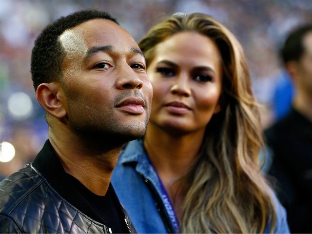 GLENDALE, AZ - FEBRUARY 01: Musician John Legend and model Chrissy Teigen look on prior to Super Bowl XLIX between Seattle Seahawks and New England Patriots at University of Phoenix Stadium on February 1, 2015 in Glendale, Arizona. (Photo by Kevin C. Cox/Getty Images)