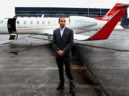 British Formula One Racing Driver Lewis Hamilton with his Bombardier Lear Jet at the Bomba