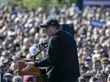 NEW YORK, NY - OCTOBER 19: Filmmaker Michael Moore speaks at a campaign rally for Democrat