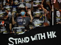Protesters shout slogans as they hold flyers at the Southorn Playground in Hong Kong on October 15, 2019, during a rally in support of NBA basketball Rockets general manager Daryl Morey and against comments made by Lakers superstar LeBron James. - US basketball superstar LeBron James on October 14, 2019, …