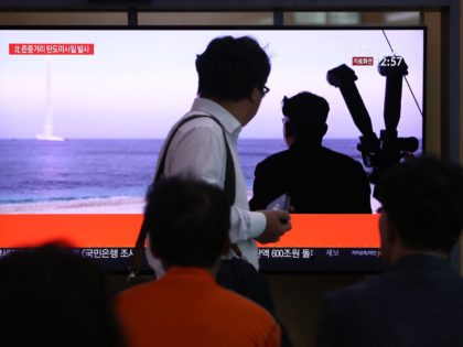 SEOUL, SOUTH KOREA - OCTOBER 02: People watch a TV showing a file image of a North Korean missile launch at the Seoul Railway Station on October 02, 2019 in Seoul, South Korea. North Korea fired what was believed to be a submarine-launched ballistic missile (SLBM) from waters off its …