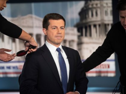 Democratic presidential candidate South Bend Mayor Pete Buttigieg prepares for an interview by FOX News Sunday anchor Chris Wallace, Sunday morning, Oct. 20, 2019, in Washington. (AP Photo/Kevin Wolf)