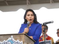 NORTH CHARLESTON, SC - OCTOBER 05: Democratic presidential candidate, Rep. Tulsi Gabbard (D-HI) addresses the crowd at the Blue Jamboree on October 5, 2019 in North Charleston, South Carolina. Six of the 2020 Democratic candidates were scheduled to attend the event. (Photo by Brian Blanco/Getty Images)