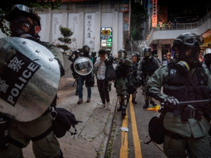 TOPSHOT - Police arrest a protester in the Wanchai area of Hong Kong on October 1, 2019, a