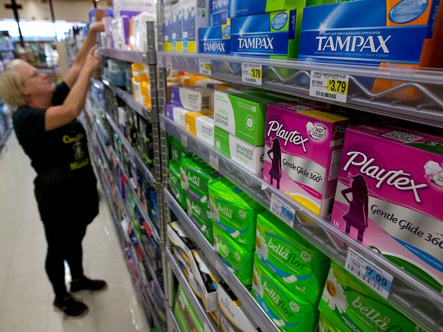 FILE - In this June 22, 2016 file photo, Tammy Compton restocks tampons at Compton's Market, in Sacramento, Calif. Bills to exempt feminine hygiene products and diapers from sales taxes were vetoed by Gov. Jerry Brown in 2016, but the measure's author's Assemblywomen Lorena Gonzalez Fletcher, D-San Diego, and Cristina …
