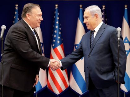 U.S. Secretary of State Mike Pompeo, left, shakes hands with Israeli Prime Minister Benjamin Netanyahu, during a meeting at the Prime Minister's residence in Jerusalem, Friday, Oct. 18, 2019. (AP Photo/Sebastian Scheiner, Pool)