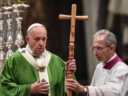Master of Pontifical Liturgical ceremonies, Italian priest Guido Marini (R) hands a crucifix to Pope Francis during a mass as part of World Mission Sunday on October 20, 2019 at St. Peter's Basilica in the Vatican. (Photo by Vincenzo PINTO / AFP) (Photo by VINCENZO PINTO/AFP via Getty Images)