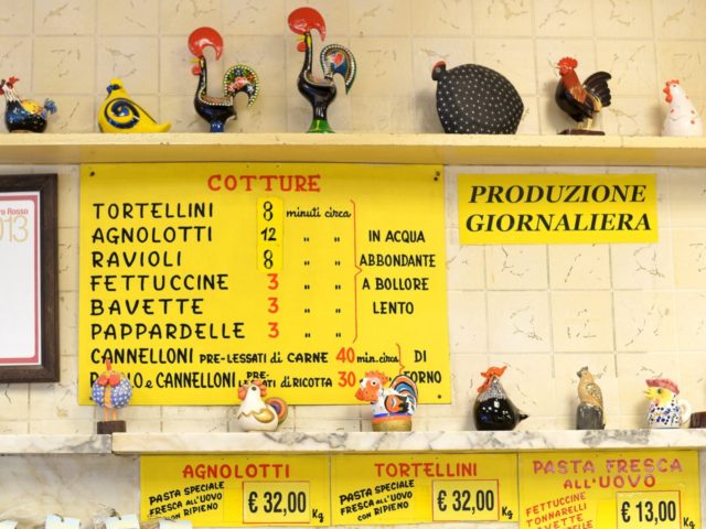 A picture shows a poster with times to cook fresh pasta and prices of tortellini and agnol