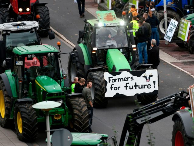 Farmers on tractors protest with a placard reading "Farmers for future" against the German government's agricultural policy including plans to phase out glyphosate pesticides and to implement more animal protection, during a demonstration in Bonn, western Germany on October 22, 2019. (Photo by Ina FASSBENDER / AFP) (Photo by INA …