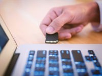 Plugging SD Memory Card into laptop for image file transfer