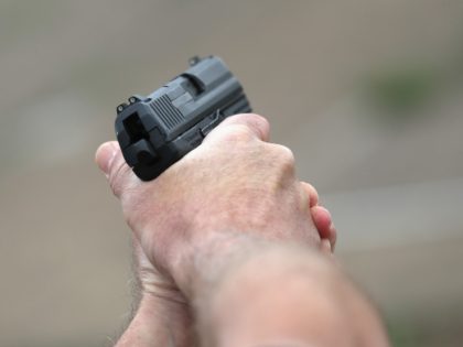 A U.S. Customs and Border Protection (CBP) agent fires an H&K P2000 handgun during a qualification test at a shooting range on February 22, 2018 in Hidalgo, Texas. CBP agents must complete firearms qualification four times per year. The agents work in the Rio Grande sector of South Texas, which …