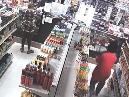 Surveillance video from C & C Beauty Supply shows two alleged armed robbers fleeing under a barrage of gunfire from the store owner.