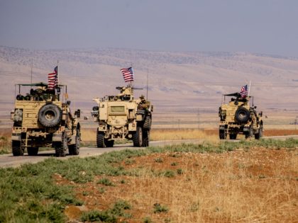 A convoy of US military vehicles drives through the Syrian northeastern town of Qahtaniyah on the border with Turkey on October 31, 2019. - US forces patrolled part of Syria's border with Turkey today in the first such move since Washington withdrew troops from the area earlier this month, an …