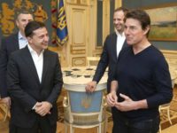 Ukrainian President Volodymyr Zelenskiy and American actor, film director and producer Tom Cruise talk to each other during their meeting in Kyiv, Ukraine, late Monday, Sept. 30, 2019. At the invitation of President of Zelensky Tom Cruise arrived in Kyiv.(Ukrainian Presidential Press Office via AP)