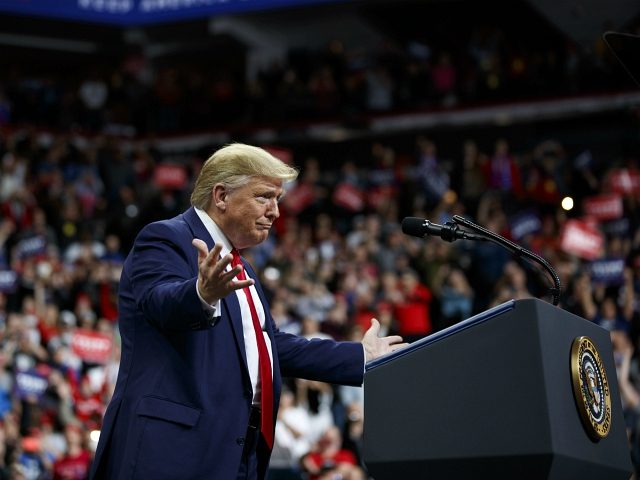 President Donald Trump arrives to speak at a campaign rally at the Target Center, Thursday