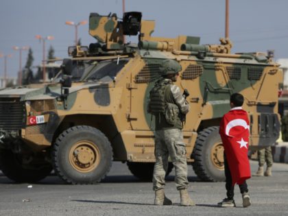 TOPSHOT - Turkish soldiers patrol the northern Syrian Kurdish town of Tal Abyad, on the border between Syria and Turkey, on October 23, 2019. - Moscow's forces in Syria headed for the border with Turkey today to ensure Kurdish fighters are pulling back after a Turkish-Russian deal wrested control of …