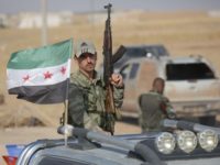 urkey-backed Syrian fighters take over areas on the road between Tal Abyad and Kobane on October 24, 2019, as Kurdish forces in northeastern Syria left several positions along the long border with Turkey, complying with a deal that sees Damascus, Ankara and Moscow carve up their now-defunct autonomous region. - …