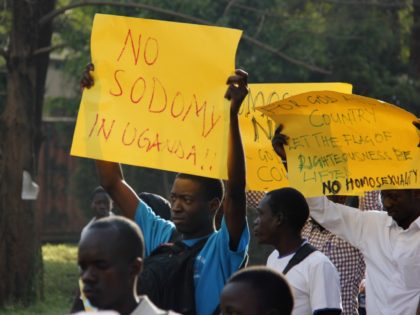 Anti-Homosexual activists march on the streets of Kampala carrying placards on August 11, 2014 to demonstrate against the recently annulled Anti-Gay law by Ugandas constitutional court. Ugandas attorney general has filed an appeal against the constitutional courts decision to overturn tough anti-gay laws, his deputy said on August 9. Branded …