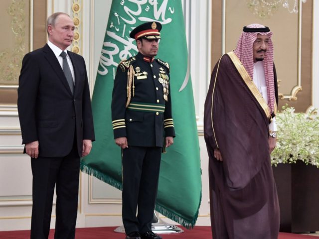 Russian President Vladimir Putin and Saudi Arabia's King Salman attend the official welcom
