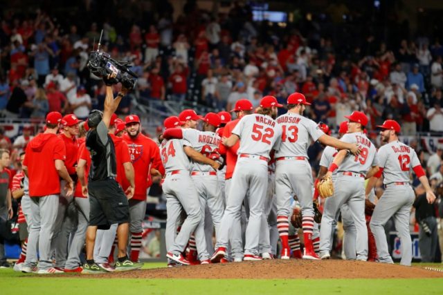 Cardinals swamp Braves in 1st, book NL showdown with Nationals