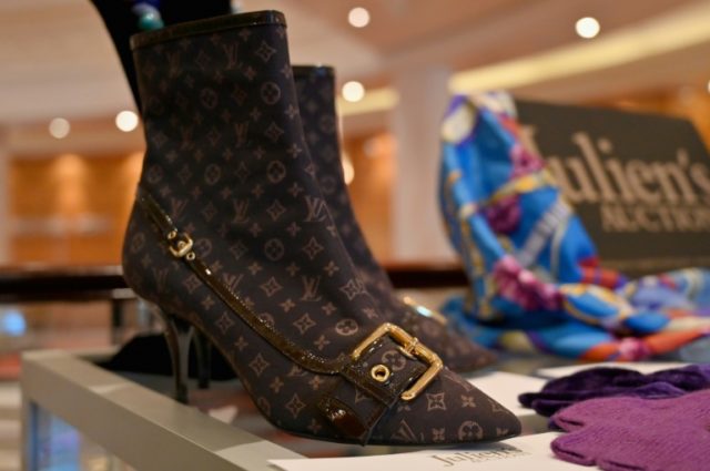 A pair of Louis Vuitton boots and other items owned by late actress Elizabeth Taylor are displayed aboard the Cunard ocean liner "Queen Mary 2" before hitting the auction block Elizabeth Taylor's personal treasures set for auction block