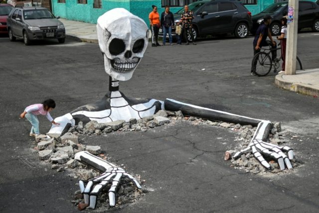 Giant skeletons come alive in Mexico for Day of the Dead