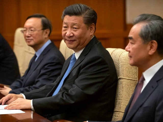 Chinese President Xi Jinping, center, sits during a meeting with Bangladesh's Prime Minist