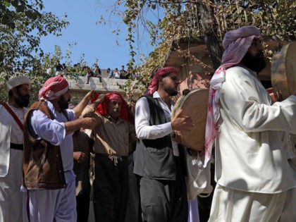 Iraqi Yazidis take part in a religious ceremony at the Temple of Lalish, in a valley near the Kurdish city of Dohuk, about 430km northwest of the Iraqi capital Baghdad, on October 10, 2019. - Of the 550,000 Yazidis in Iraq before the Islamic State (IS) group invaded their region …
