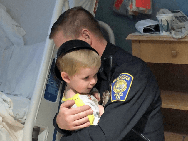 A two-year-old patient on the Pediatric Unit thought a hug from a police officer would ens
