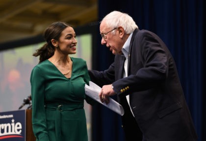 DES MOINES, IA - NOVEMBER 09: U.S. Rep. Alexandria Ocasio-Cortez (D-NY) is joined on stage by Democratic Presidential candidate Bernie Sanders (I-VT) during the Climate Crisis Summit at Drake University on November 9, 2019 in Des Moines, Iowa. Sanders, Ocasio-Cortez, and author Naomi Klein spoke about the current state of …