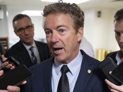 Sen. Rand Paul, R-Ky., responds to reporters at the Capitol after he threatened to reveal the name of the Ukraine whistleblower who helped initiate the impeachment inquiry against President Donald Trump by providing details of Trump's call with the Ukrainian president, in Washington, Wednesday, Nov. 6, 2019. (AP Photo/J. Scott …