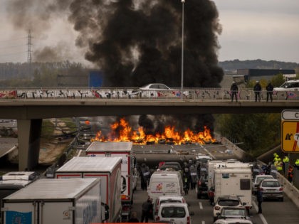 National police disperse pro-independence demonstrators blocking a major highway near Girona, Spain, Wednesday, Nov.13, 2019. Hundreds of car and truck drivers were stuck Wednesday in a large traffic jam in northeastern Spain caused by Catalan separatists blocking a major highway near the city of Girona. (AP Photo/Emilio Morenatti)