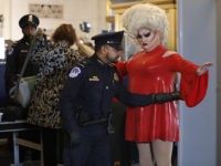 Pissi Myles, right, a special contributor with Happs News, a live news source that streams through Twitter, goes through security, Wednesday, Nov. 13, 2019, on Capitol Hill in Washington, as she arrives for the first public impeachment hearings of President Donald Trump's efforts to tie U.S. aid for Ukraine to …