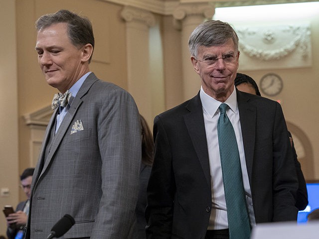 Career Foreign Service officer George Kent, left, and the top U.S. diplomat in Ukraine William Taylor, center, return from a break as they testify before the House Intelligence Committee on Capitol Hill in Washington, Wednesday, Nov. 13, 2019, during the first public impeachment hearings of President Donald Trump's efforts to …
