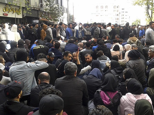 Protestors attend a demonstration after authorities raised gasoline prices, in the norther