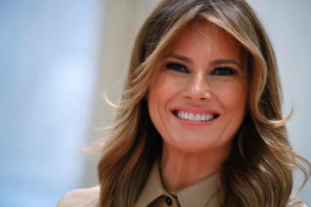 First lady Melania Trump smiles during an event to pack "comfort kits" to be sen