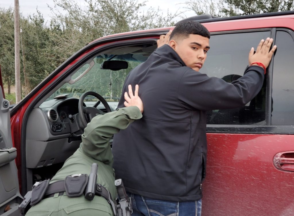 Rio Grande Valley Sector Border Patrol agents arrest a U.S. citizen for allegedly smuggling three Chinese nationals into the U.S. Photo: Bob Price/Breitbart Texas)